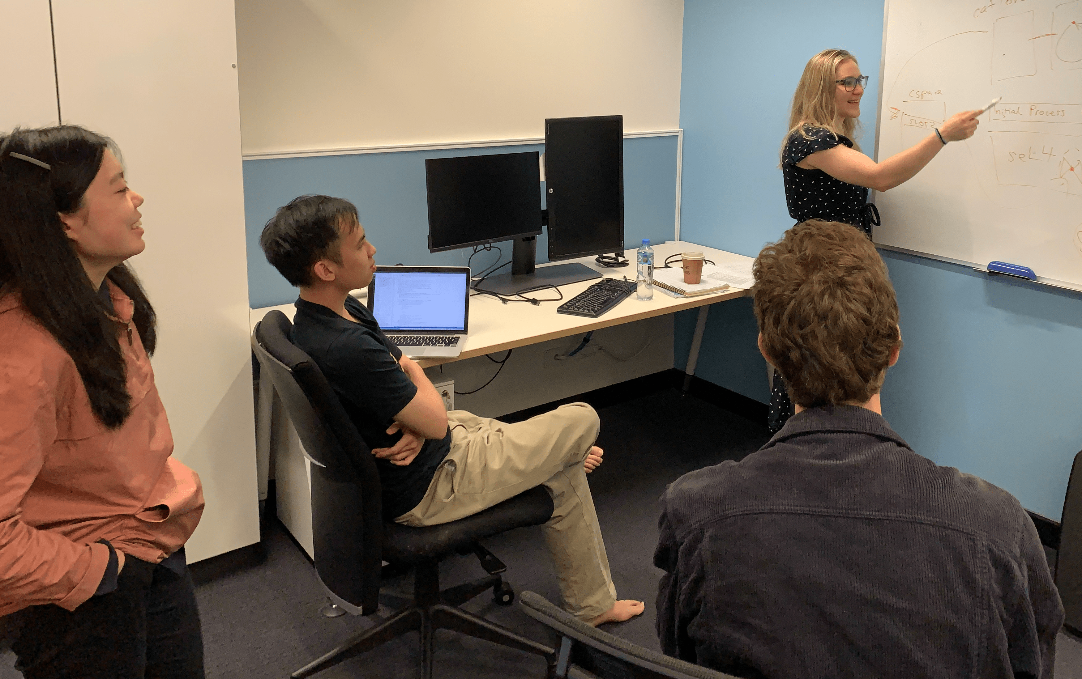 TS students discussing research.